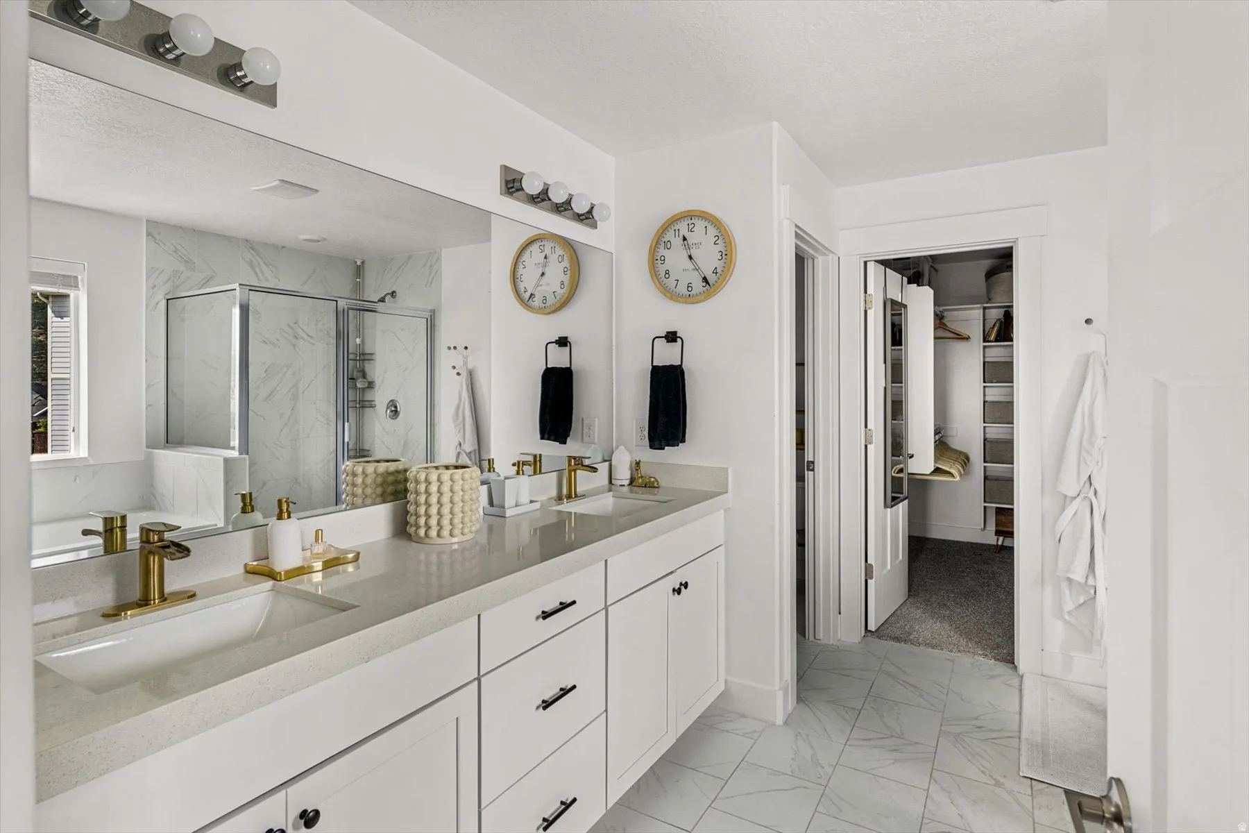 Dual vanity with integrated sinks and gold-finish faucets