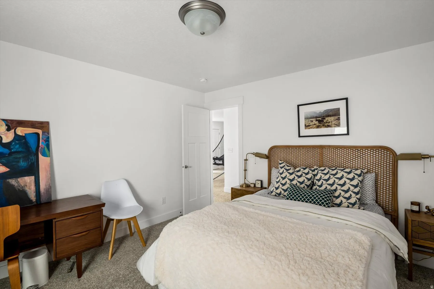 Neutral wall paint, carpet flooring, and a flush mount ceiling fixture