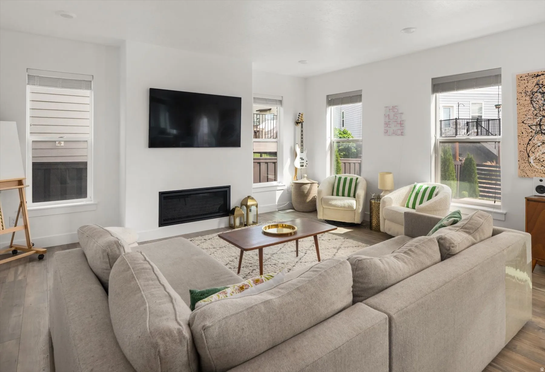 Open-concept living area with light wood-finish flooring