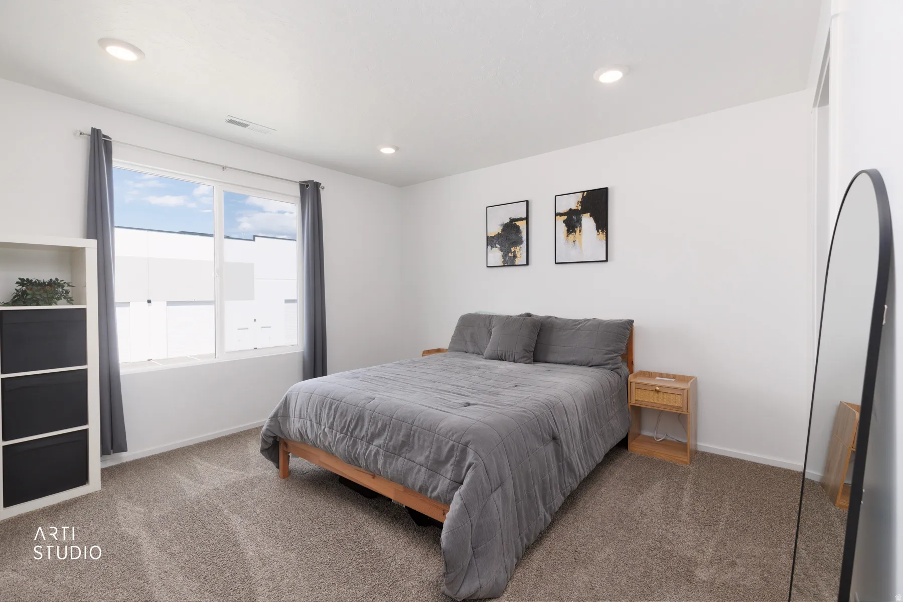 Recessed lighting, large window, and wall-to-wall carpeting