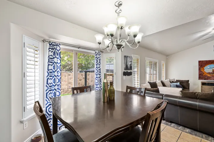 Integrated dining and living area with a vaulted ceiling