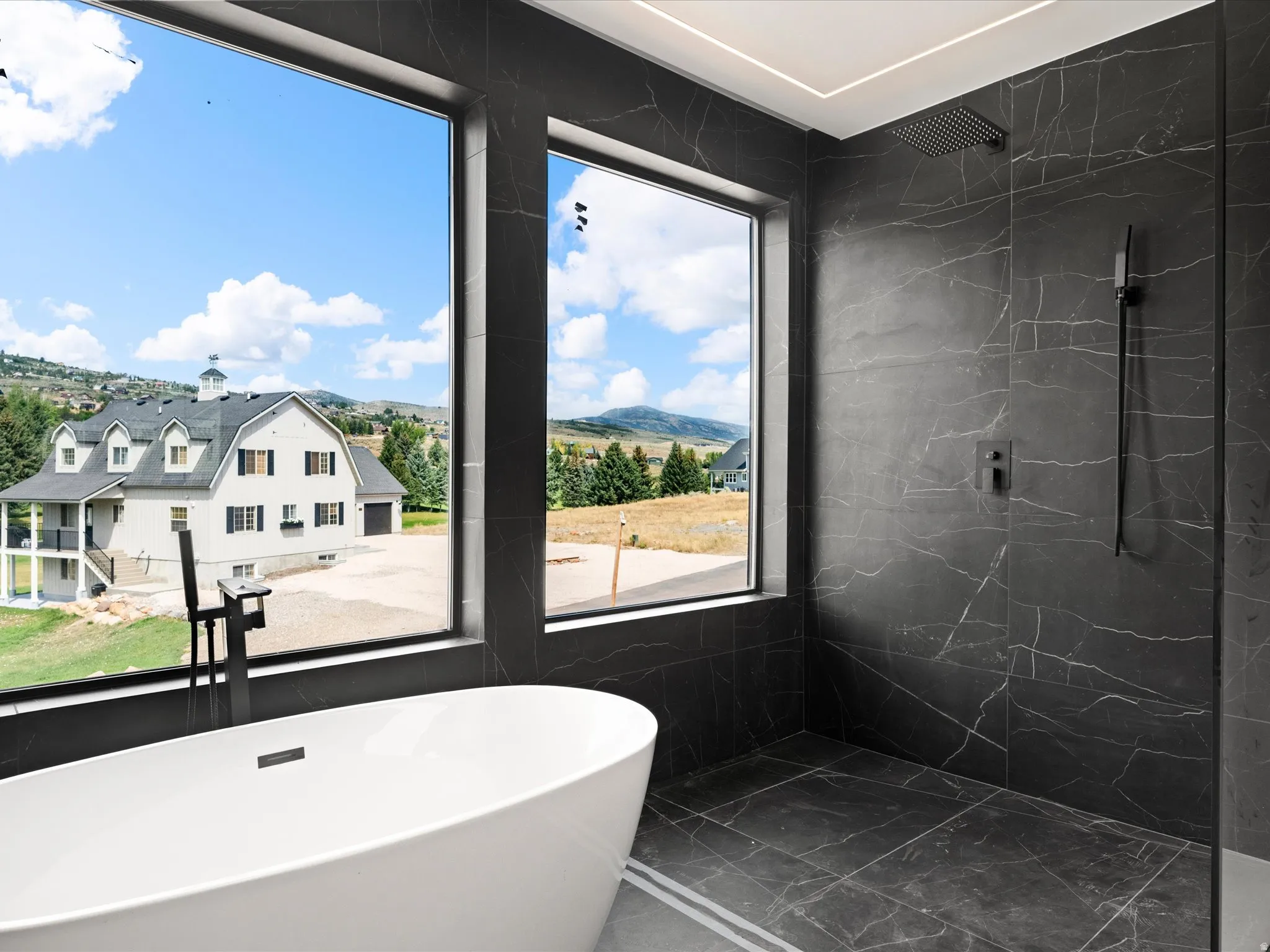 2nd Level Master En-Suite, Freestanding soaking tub with a floor-mounted matte black faucet