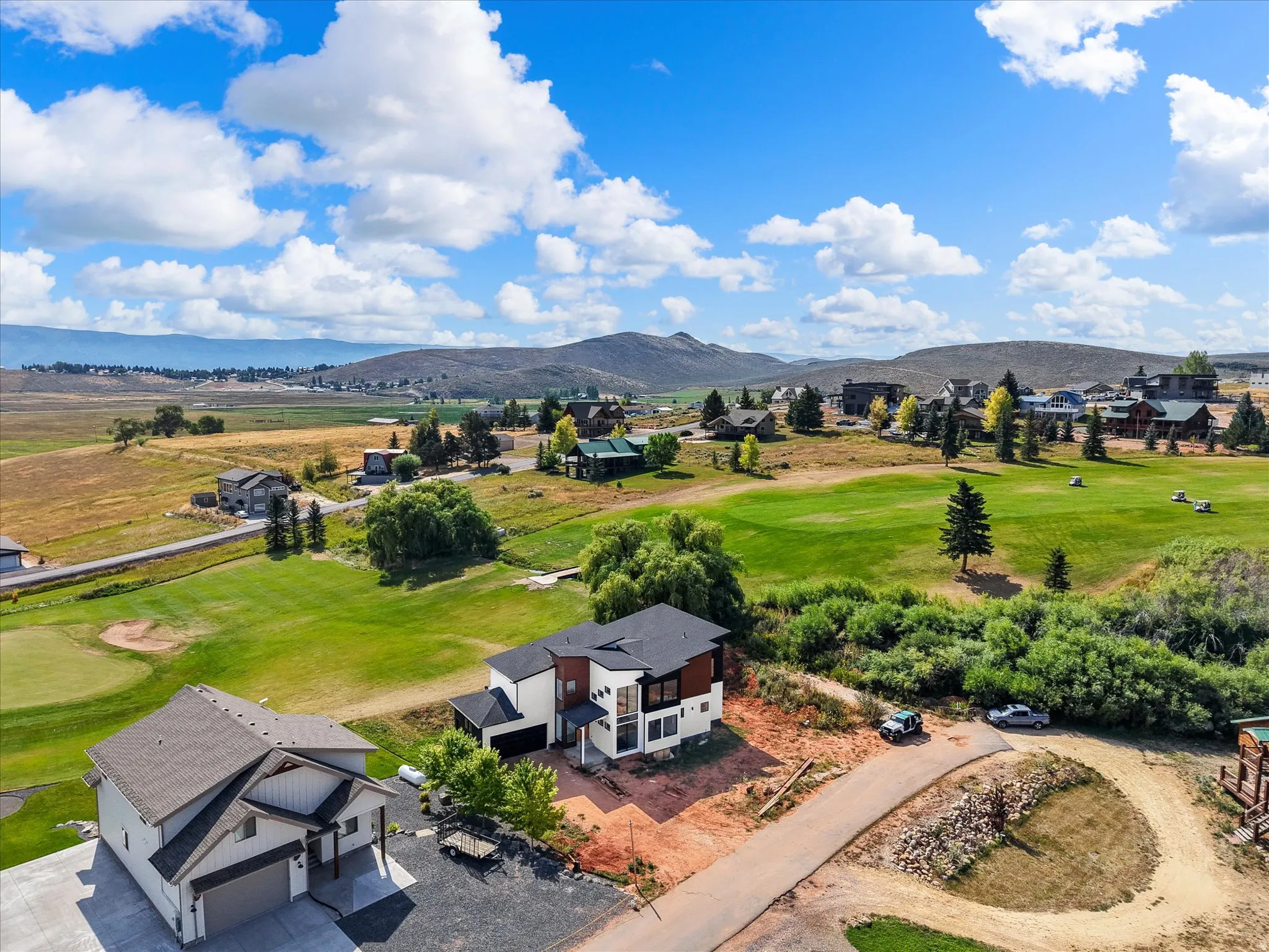 View of the home and the proximity to Bear Lake, neighboring homes and 2nd hole at Bear Lake Golf Course