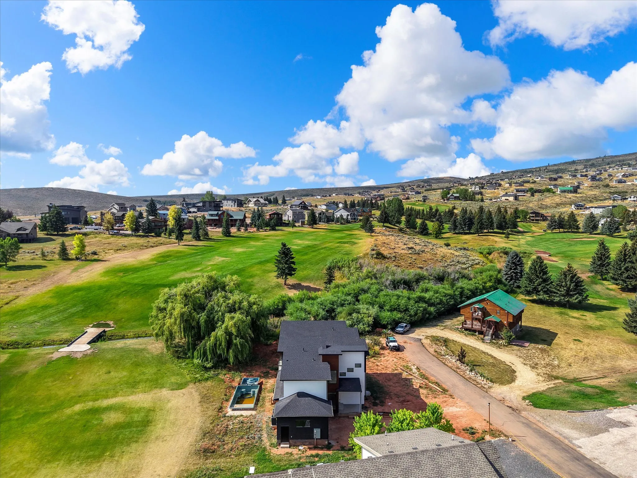 View of the home and the proximity to the 2nd hole at Bear Lake Golf Course