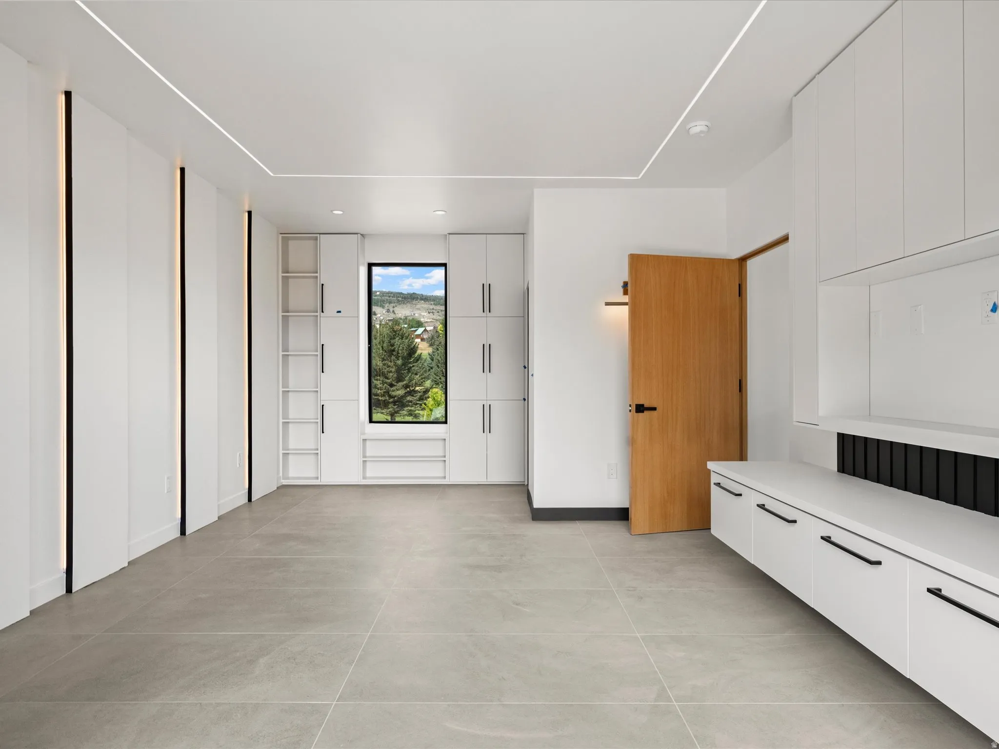 2nd Level Master Suite w/ built in cabinetry and tv niche