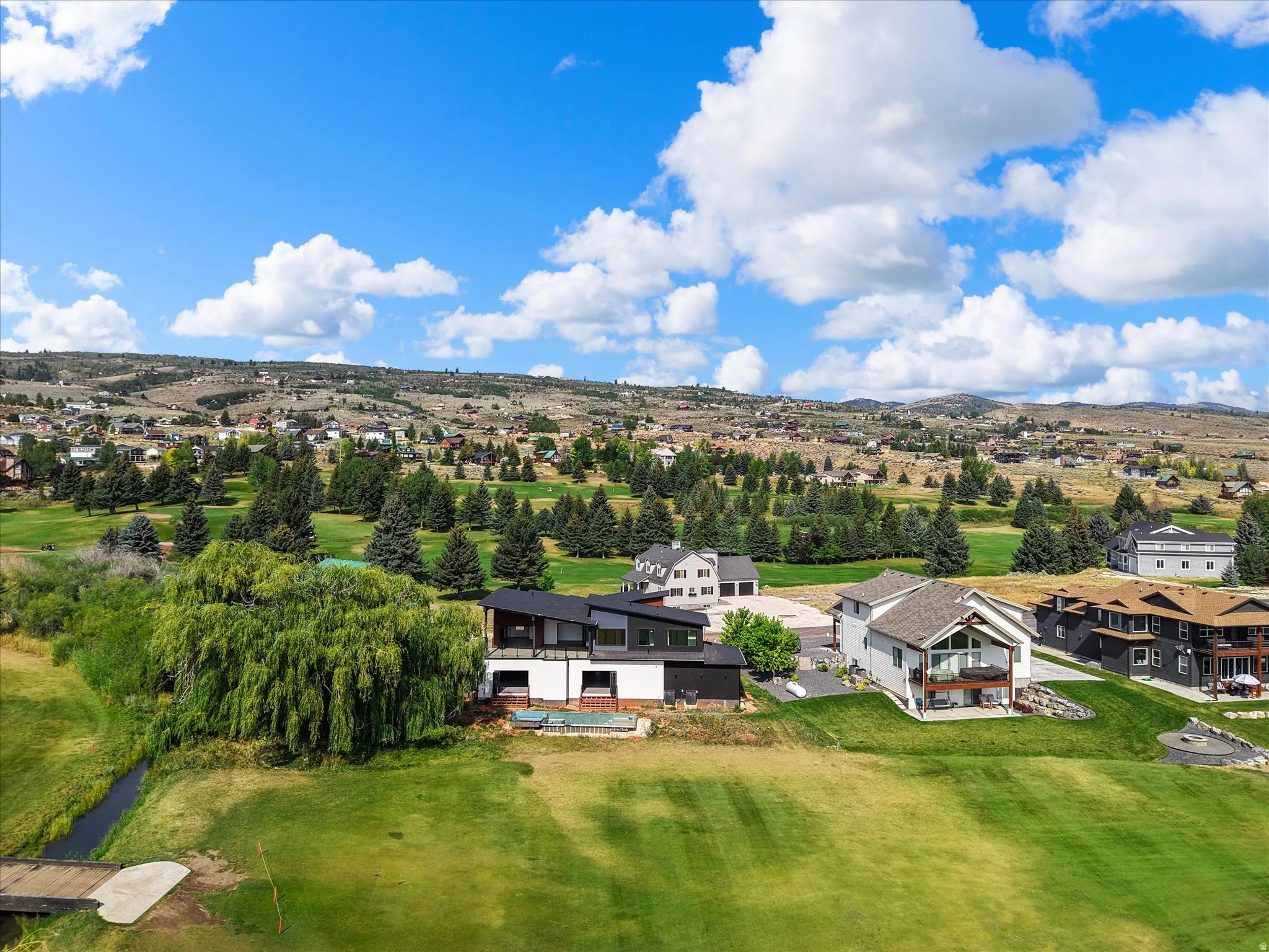 View of the home and the proximity to the 2nd hole at Bear Lake Golf Course