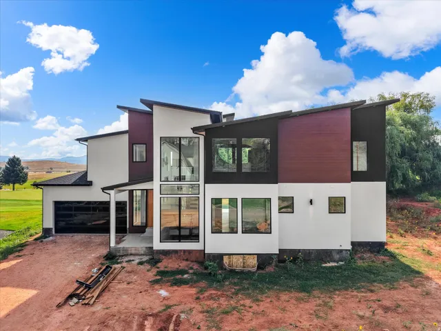 Modern architectural design with multi-level rooflines and mixed material facade
