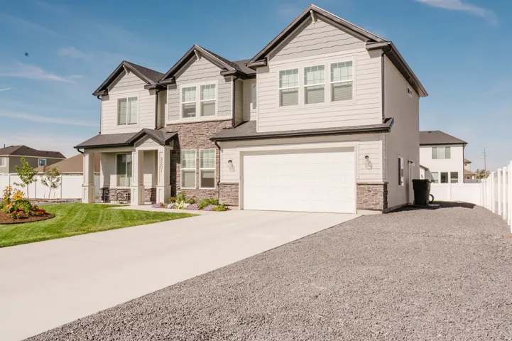 Contemporary exterior with mixed material siding and stone accents