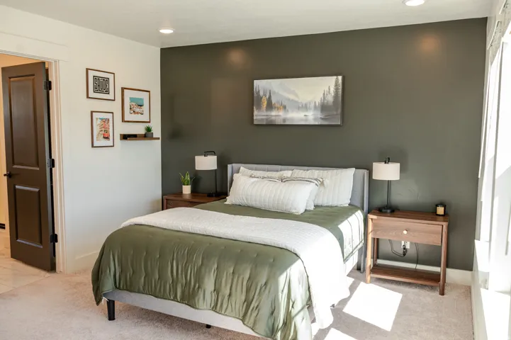 Spacious room with a neutral carpet, recessed lighting, and a dark accent wall