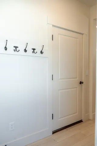 White paneled door with black hardware
