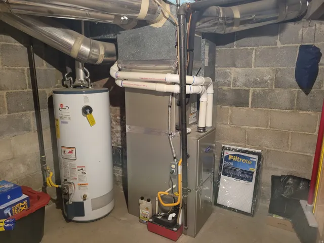 Water heater and forced air unit installed on a concrete floor