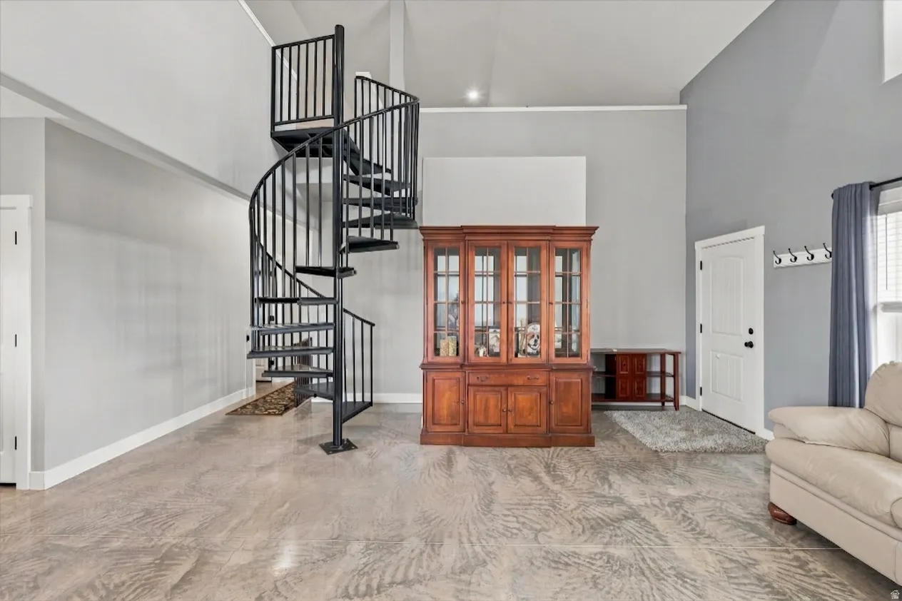One of a kind feature of a spiral staircase to loft area.