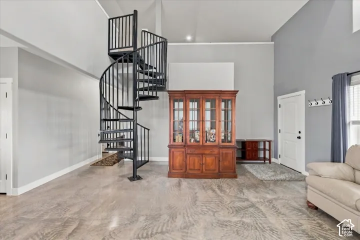 One of a kind feature of a spiral staircase to loft area.