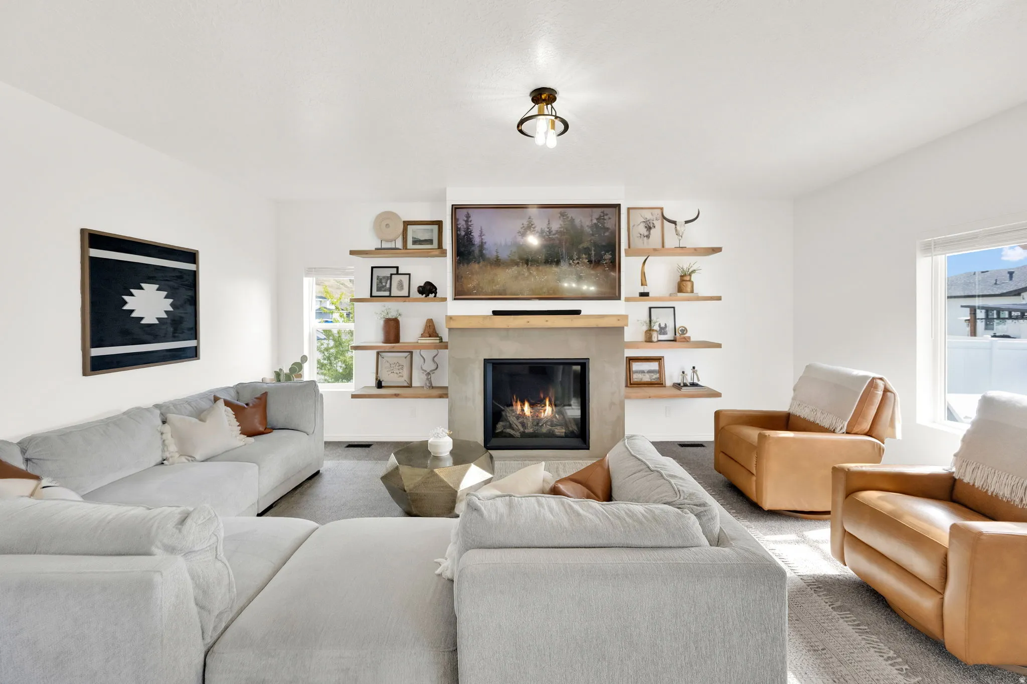 Spacious living room with gas fireplace and tasteful decoration