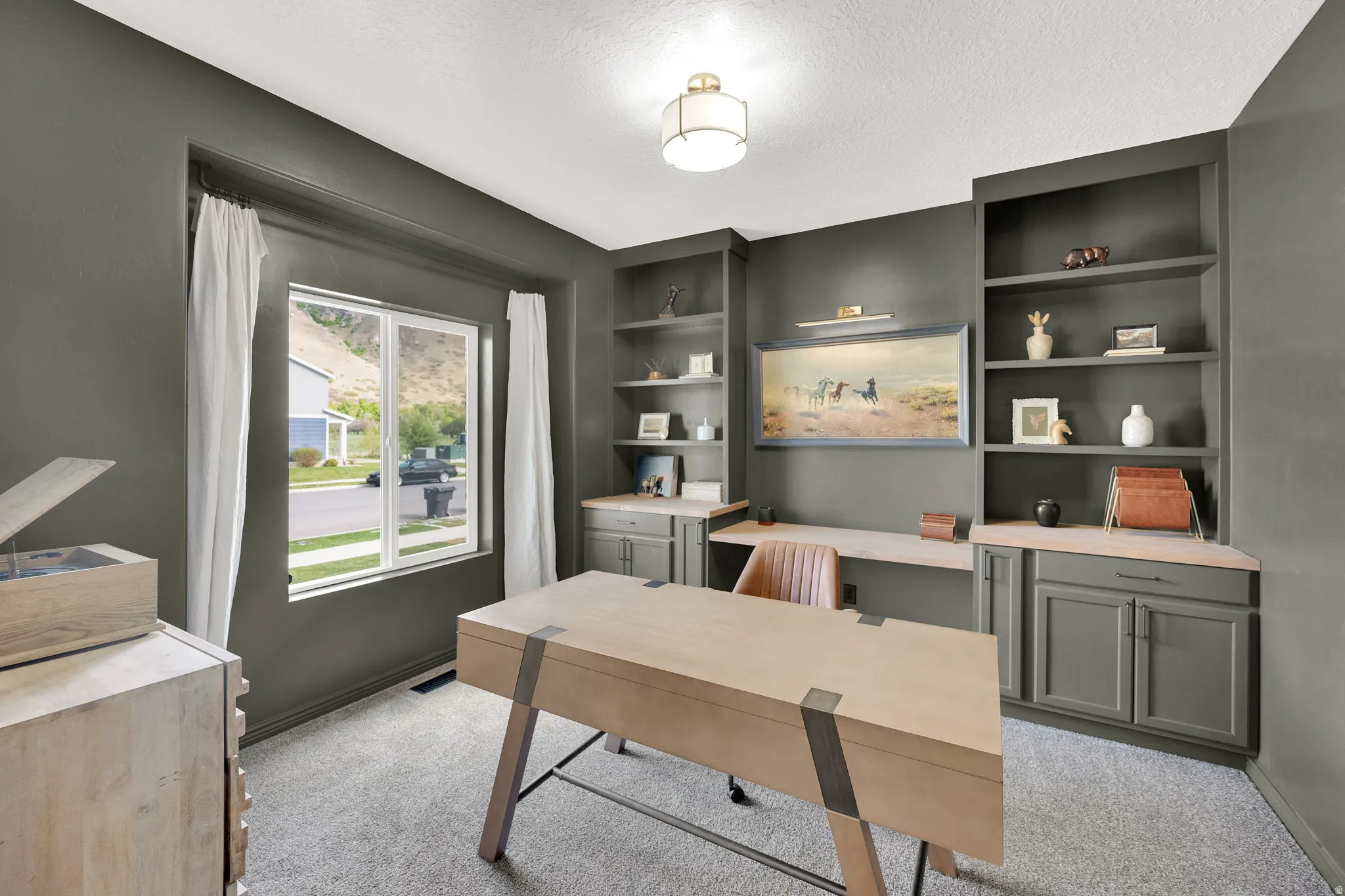 The perfect works space offering built-in shelving, Mountain View's, and plenty of room to get things done