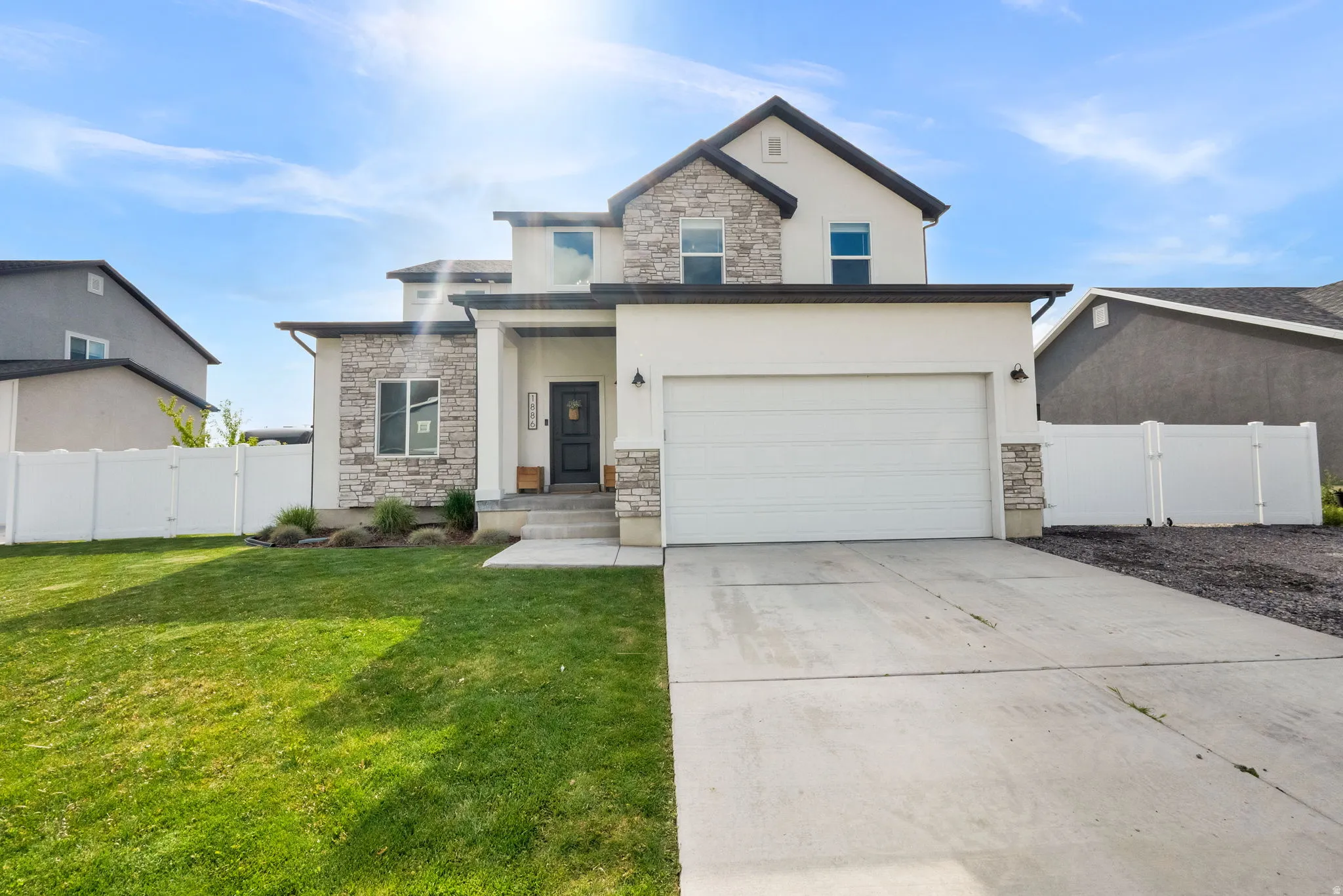 Spacious to car garage with additional RV parking behind fence