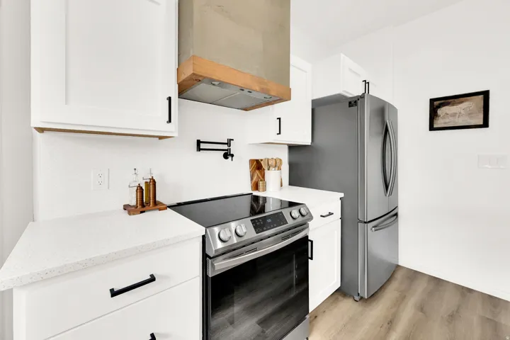 Upgraded vent hood, pot filler, herringbone tile, etc. It's the perfect place to highlight your culinary skills