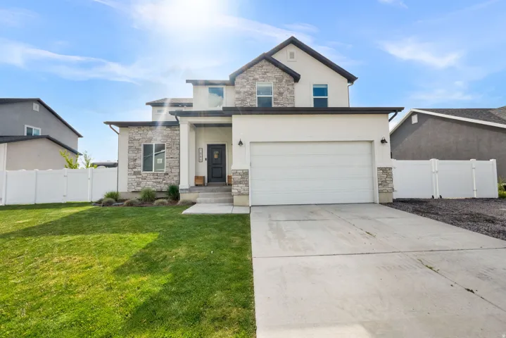 Spacious to car garage with additional RV parking behind fence