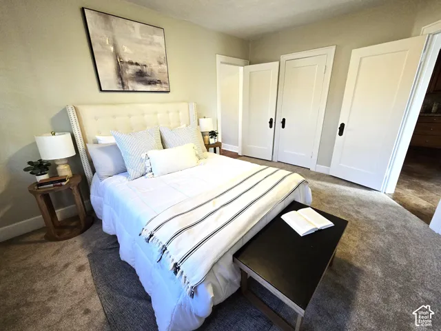 Neutral interior featuring wall-to-wall carpeting and three-panel solid core doors with matte black hardware