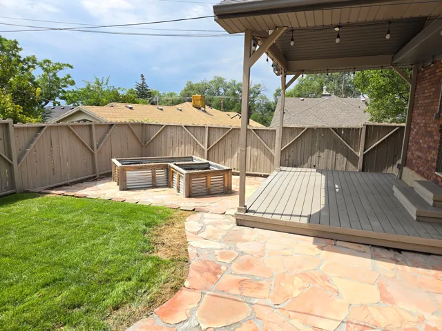 Covered patio with composite decking and string lighting