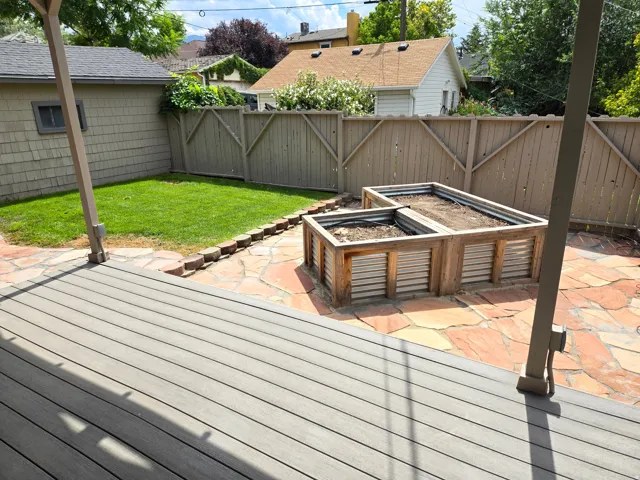 Composite deck with a stone patio