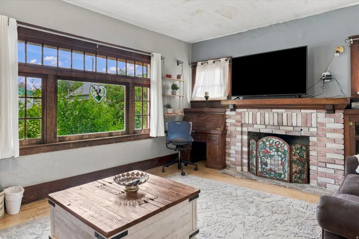 Brick fireplace with a decorative screen