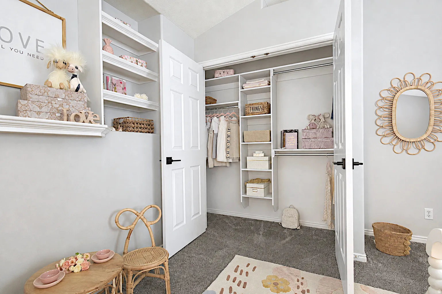 Built-in shelving, closet with organizational system, white paneled doors, wall-mounted display shelving