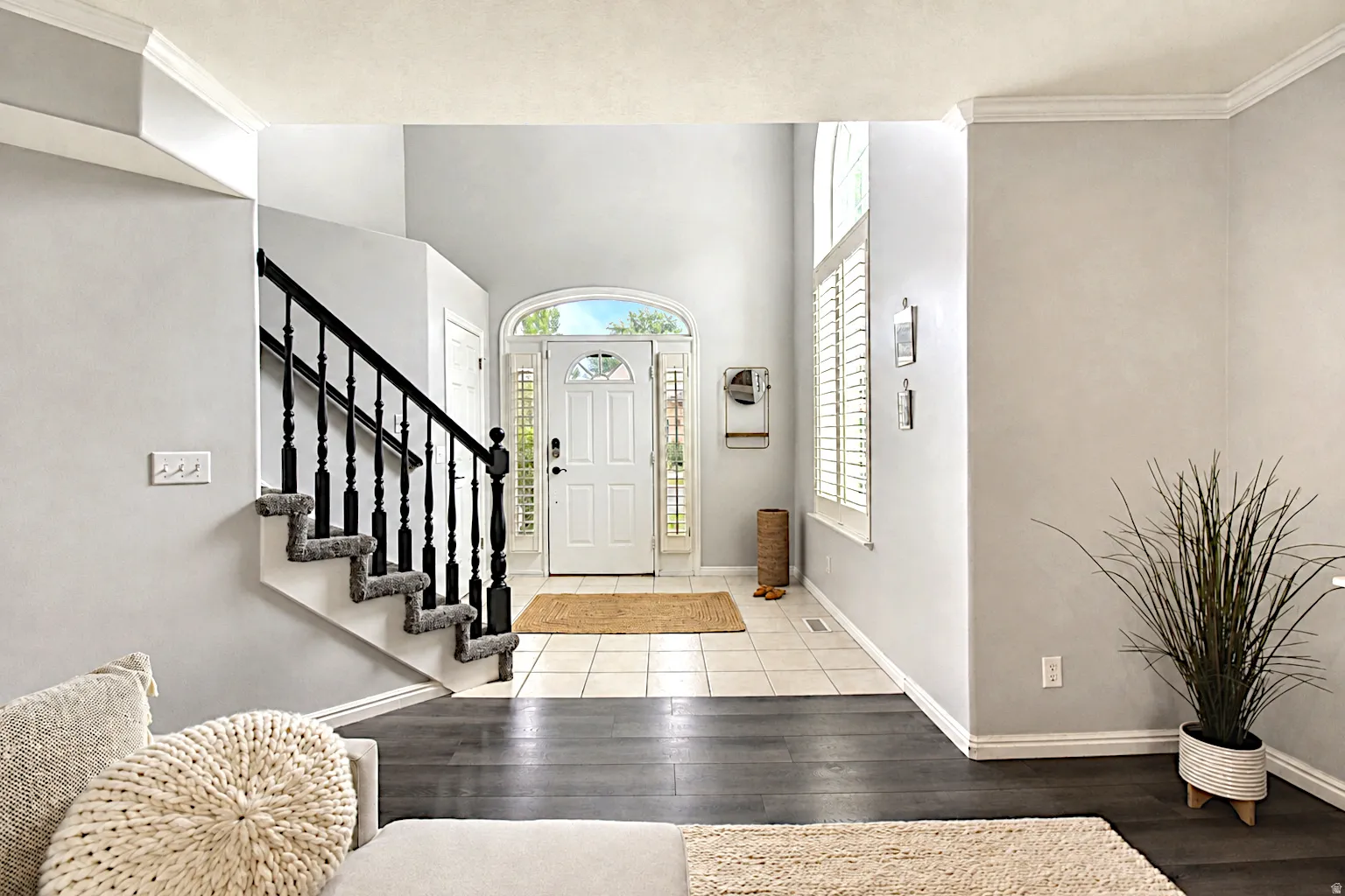 Foyer with arched transom, and sidelights
