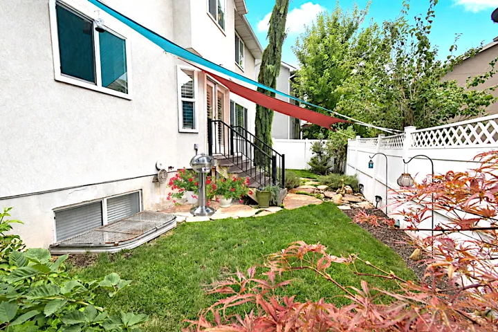 Landscaped backyard with an established lawn