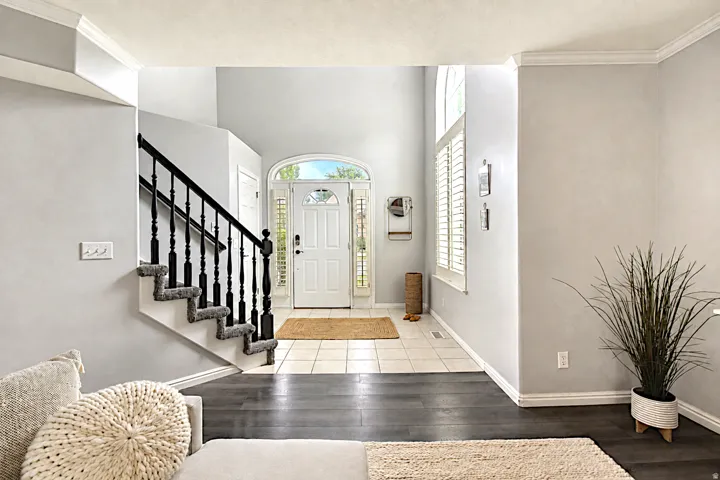 Foyer with arched transom, and sidelights