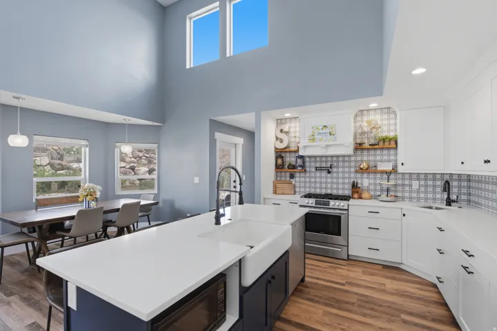 Gourmet Kitchen featuring: 2 sinks, pot filler, apron sink, and extended quartz island
