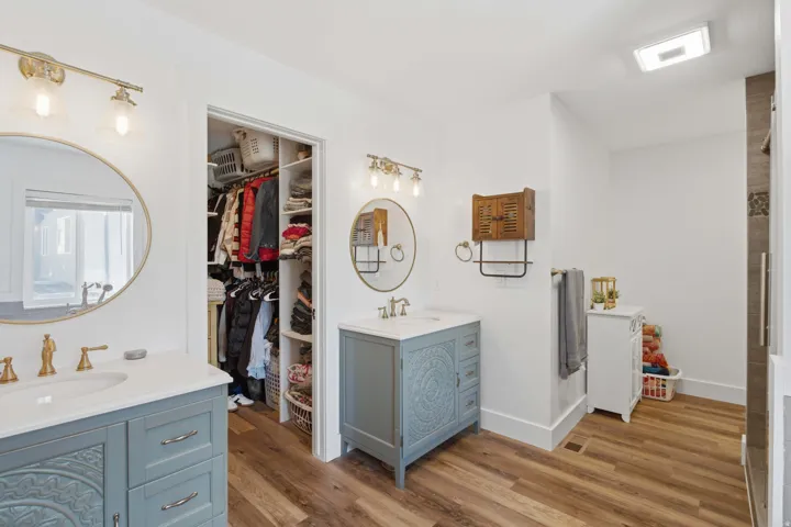Primary Grand Master Bathroom featuring dual vanities