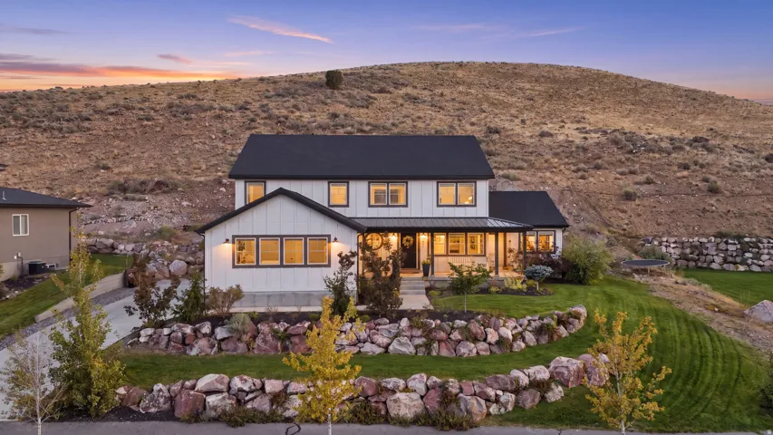 Modern farmhouse exterior with white siding and black trim windows