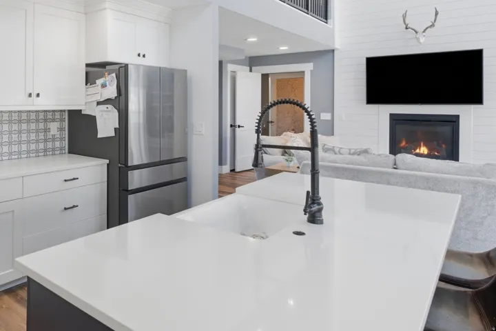 Spacious kitchen island with an integrated sink and gooseneck faucet