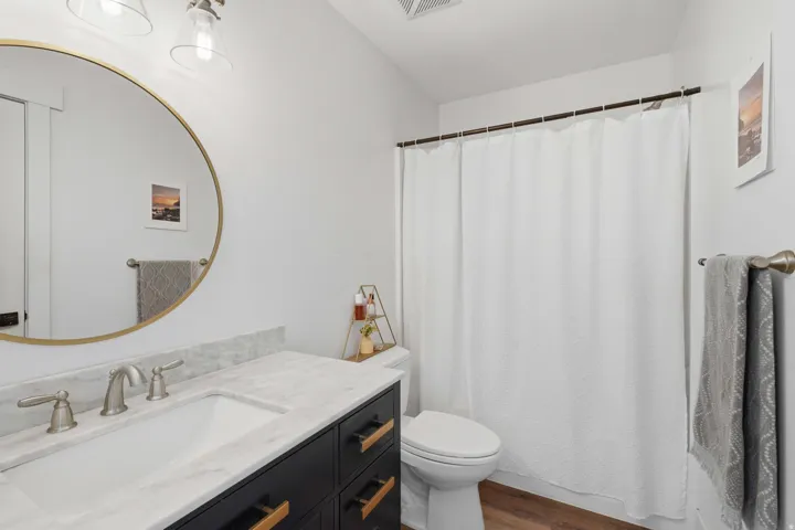 White walls with wood-finish flooring