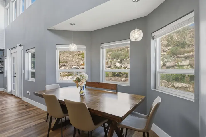 Large extended dining space; the back portion of the home has three separate entrances