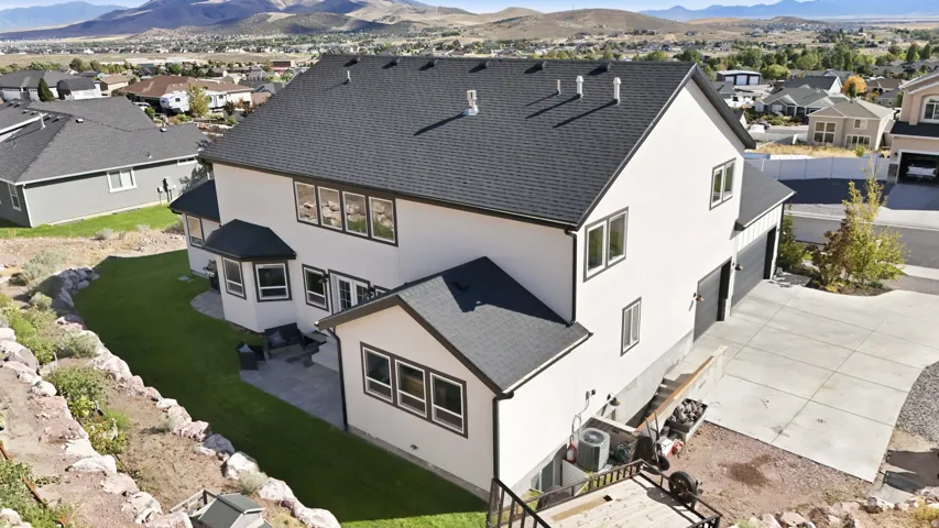 View of the extended RV parking and the 2 separated, private entrances to the ADU and owner's portion of the basement