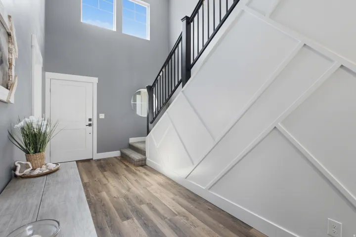 Grand entryway and extra wide foyer ;beautiful railing upgrade