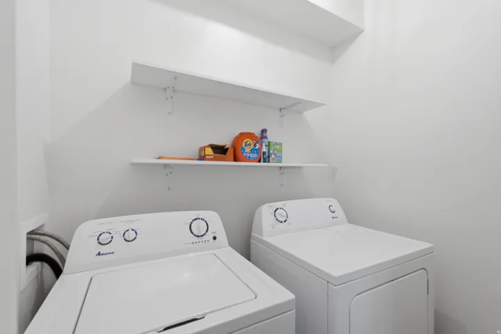 Laundry area featuring shelving