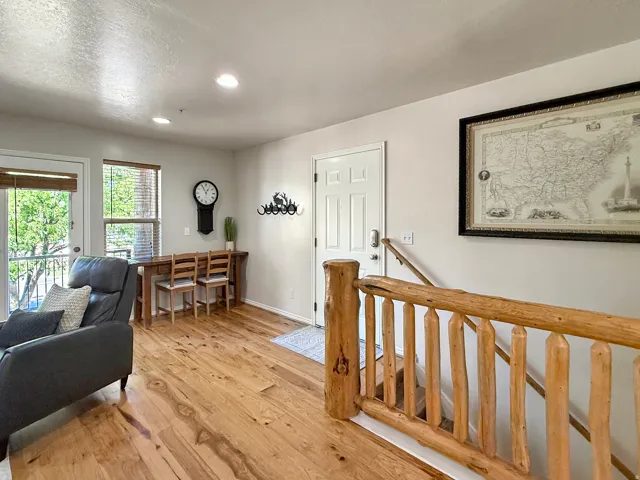 Spacious living room with desk space, perfect for working in your mountain retreat. Real hardwood floors and beautiful furnishings to relax in your home away from home.