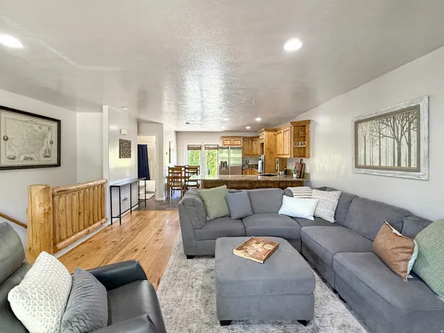 Sold fully furnished and turn-key, open concept kitchen, dining, and living area with real hardwood floors. Kitchen has knotty alder cabinets, beautiful granite counters, and access to the open back patio for morning sunrises, evening grilling, and relaxi