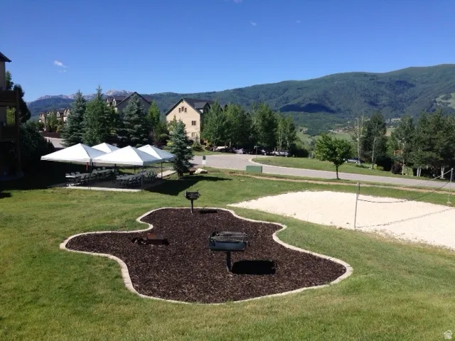 Enjoy the covered picnic and grilling area with sand volleyball court, perfect for parties and gathering for summer fun.