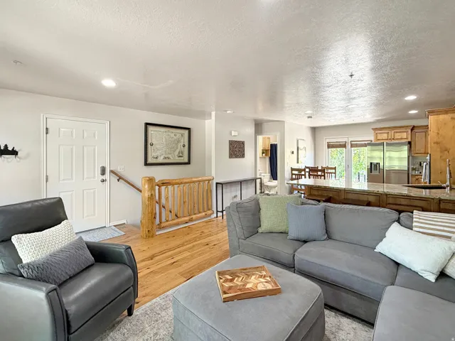 Sold fully furnished and turn-key, open concept kitchen, dining, and living area with real hardwood floors. Kitchen has knotty alder cabinets, beautiful granite counters, and access to the open back patio for morning sunrises, evening grilling, and relaxi