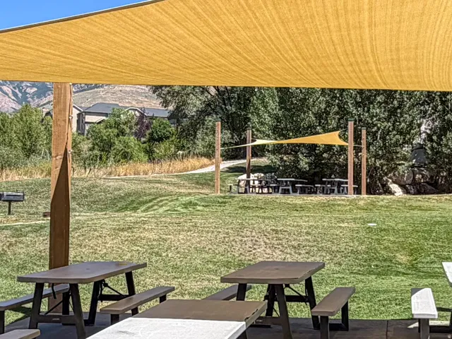Enjoy the covered picnic and grilling area with sand volleyball court, perfect for parties and gathering for summer fun.