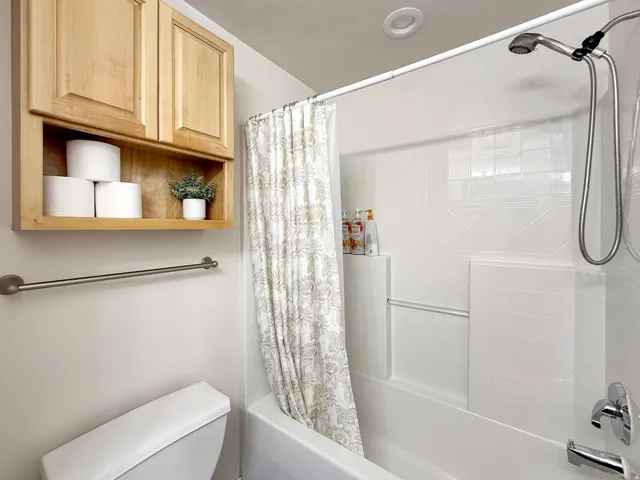 Shared hallway full bath in the basement for guest convenience. Gorgeous granite countertops and knotty alder cabinets.