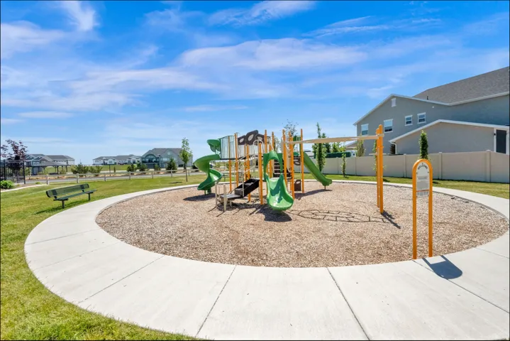 Community playground with multiple slides, swings, and climbing structures