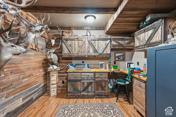 Wood-panel walls and ceiling with integrated wood beams