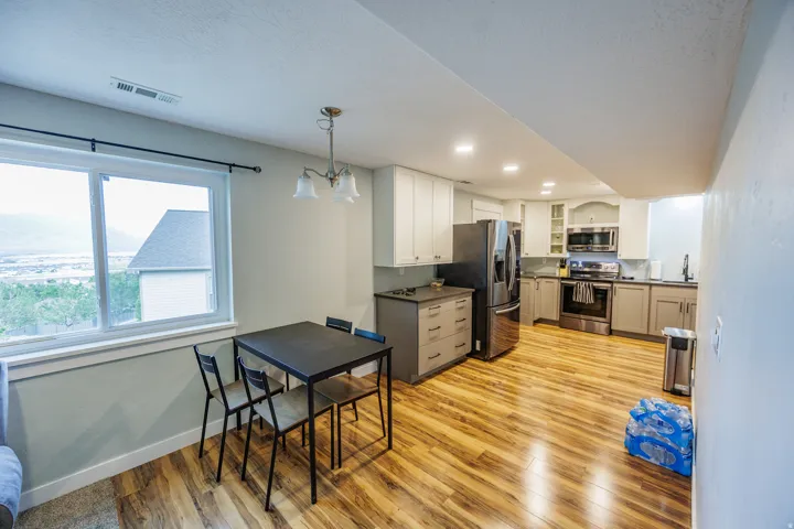 Wood-finish flooring throughout the kitchen and dining area
