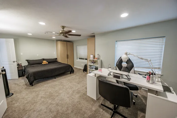 Recessed lighting, ceiling fan, and light gray walls