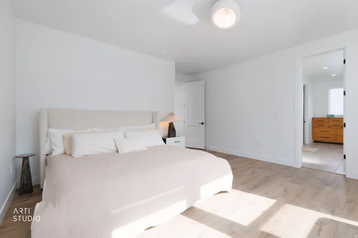 Wood-finish flooring with white walls and trim